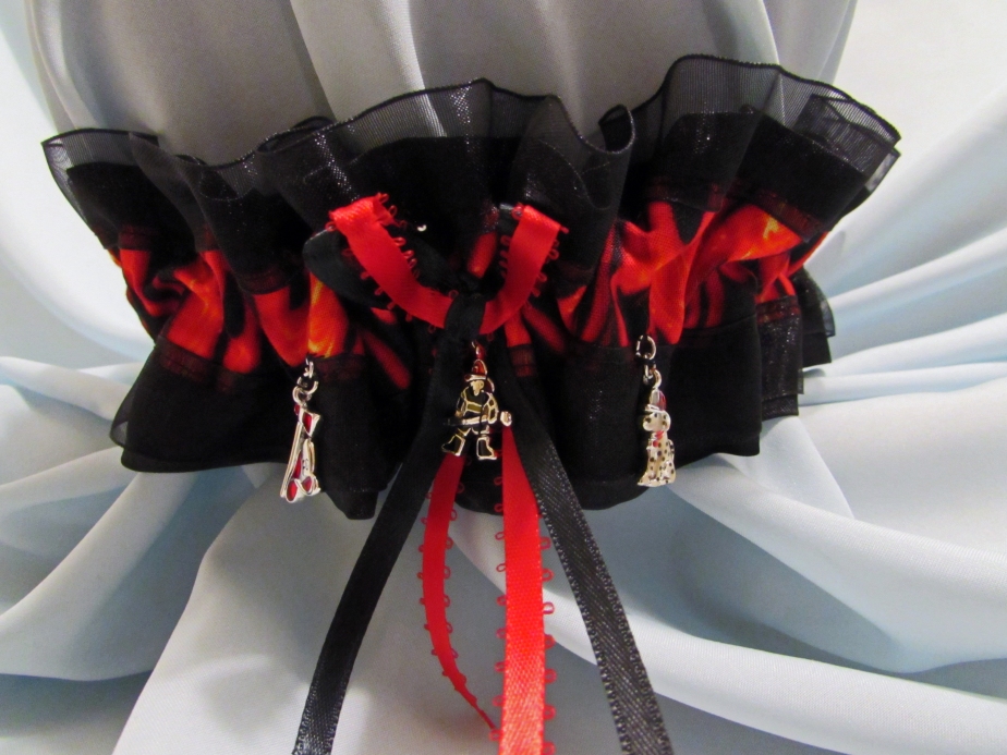 Another surprise garter!  This bride chose a fire theme w flame fabric, black satin/tulle and fire themed charms