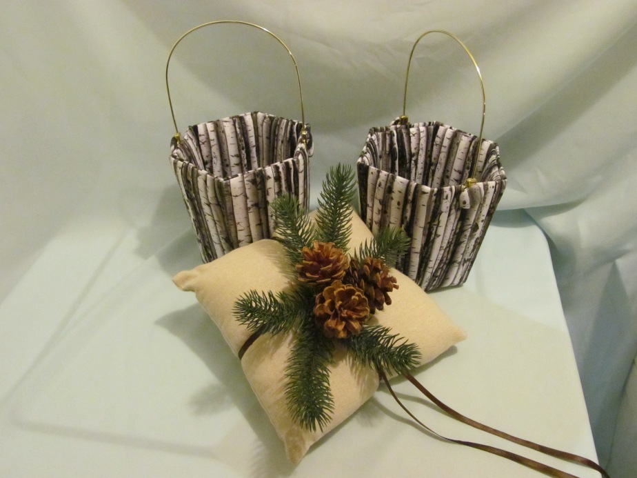 Flower girl baskets made to look like birch baskets and natural linen ring bearer pillow.  It was a December wedding.